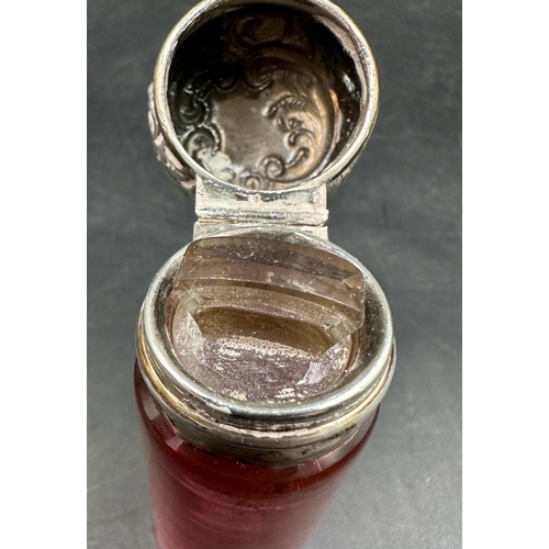 423 - A cranberry glass and silver scent bottle hallmarked for Birmingham 1899.