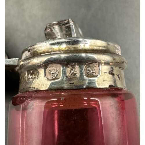 423 - A cranberry glass and silver scent bottle hallmarked for Birmingham 1899.