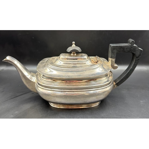 428 - A silver teapot, hallmarked for Sheffield 1990 with ebonised handle and finial, by Mappin and Webb.