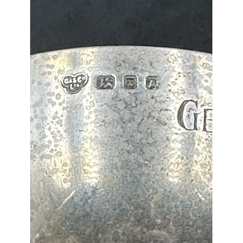 433 - A small silver golf trophy, engraved and hallmarked for London.