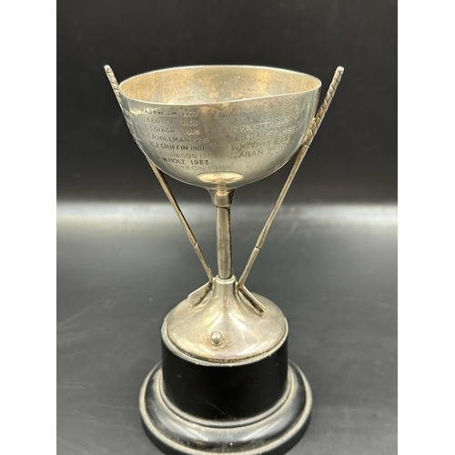 433 - A small silver golf trophy, engraved and hallmarked for London.