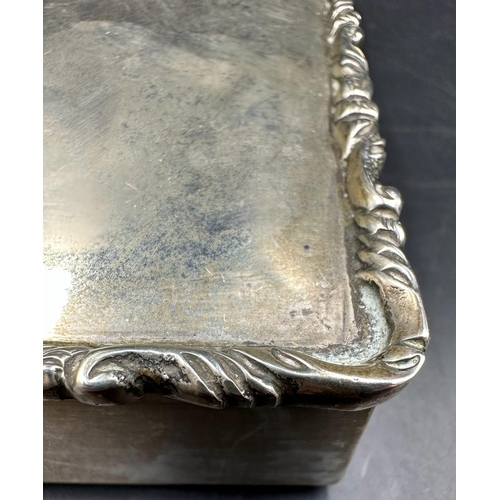 451 - A Mexican silver cigarette box with ornate edge to lid, Sterling mark to base.