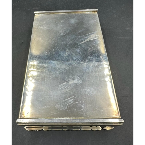 451 - A Mexican silver cigarette box with ornate edge to lid, Sterling mark to base.