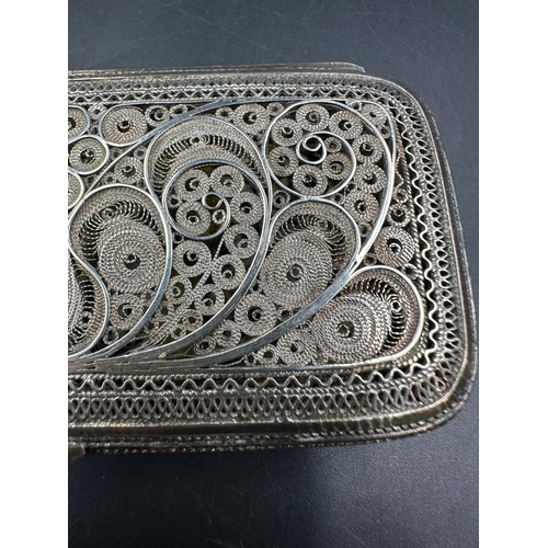 468 - A silver filigree cigarette case