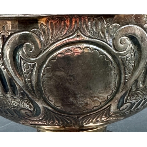 479 - A silverplated punch bowl with detachable crown with lion ring handles and weighted base