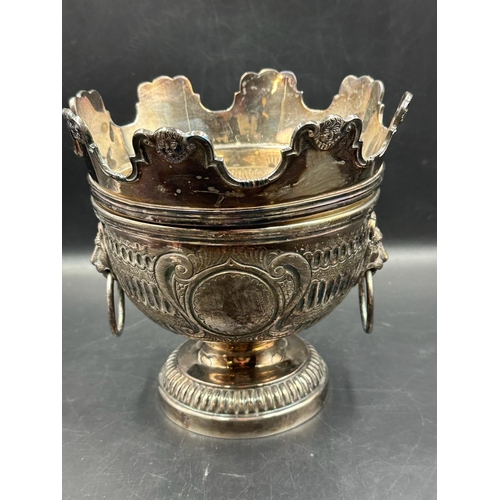 479 - A silverplated punch bowl with detachable crown with lion ring handles and weighted base