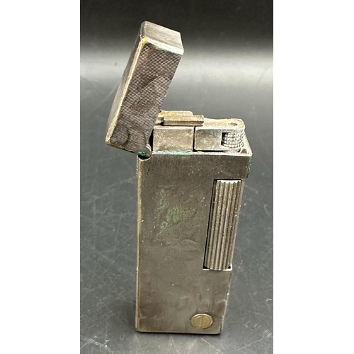 483 - A Dunhill white metal lighter in original box with original paperwork, cards etc.