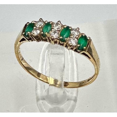 495 - A 9ct gold fashion ring with czs and green stones.