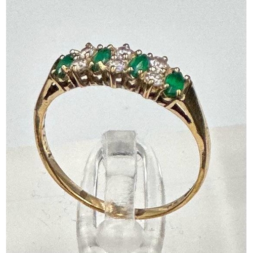 495 - A 9ct gold fashion ring with czs and green stones.