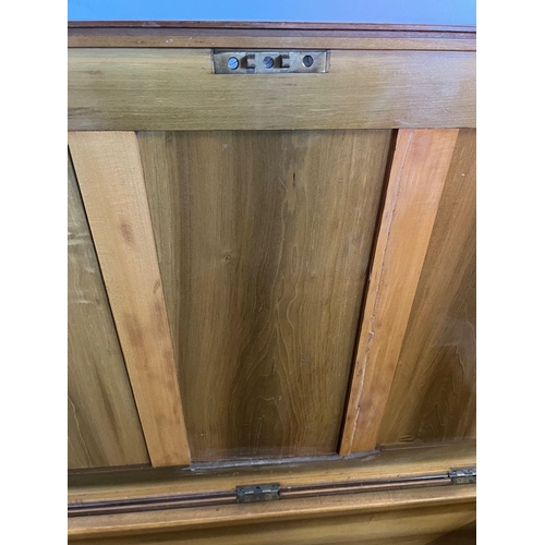 50 - A large pine panelled blanket box or chest with brass drop handles to sides (H70cm W109cm D73cm)