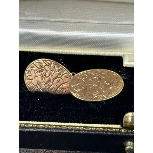 502 - A boxed pair of Edwardian 9 carat gold, foliate engraved design cuff links, hallmarked for Chester 1... 