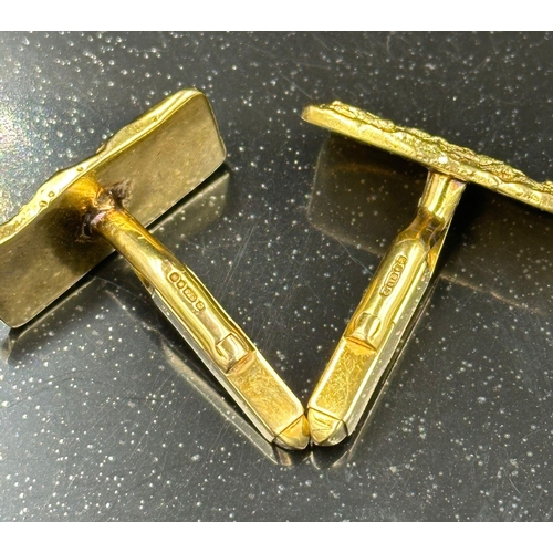 504 - A pair of 9ct gold, cuff links with a bark design, hallmarked for London 1975 and with an approximat... 