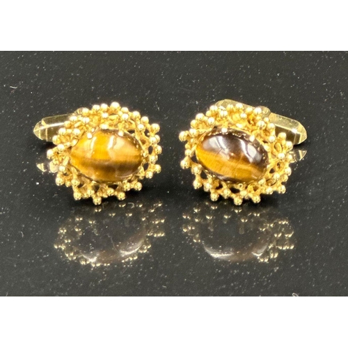 505 - A pair of fabulous Tigers Eye 9ct gold cuff links, hallmarked in London and with an approximate weig... 