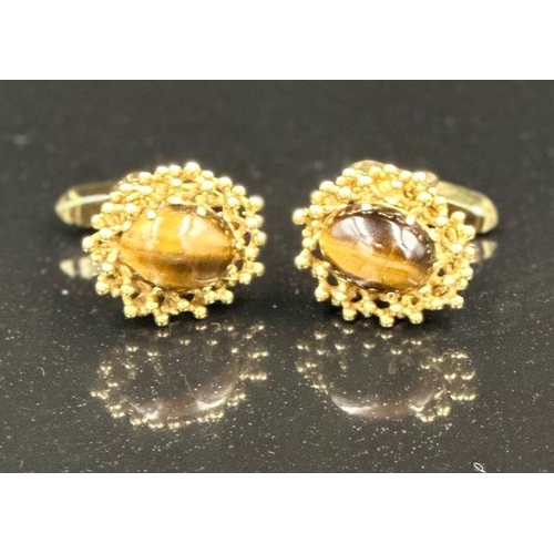 505 - A pair of fabulous Tigers Eye 9ct gold cuff links, hallmarked in London and with an approximate weig... 