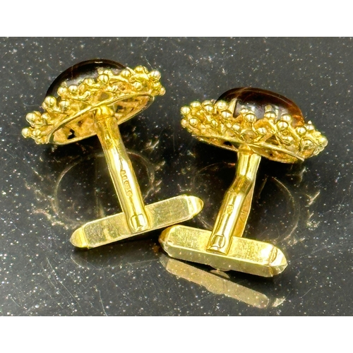 505 - A pair of fabulous Tigers Eye 9ct gold cuff links, hallmarked in London and with an approximate weig... 