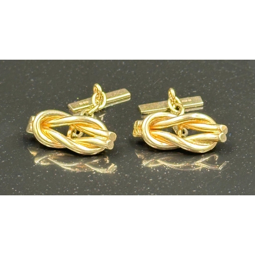 507 - A pair of 9ct gold cuff links with a knot style design, an approximate weight of 7.3g.