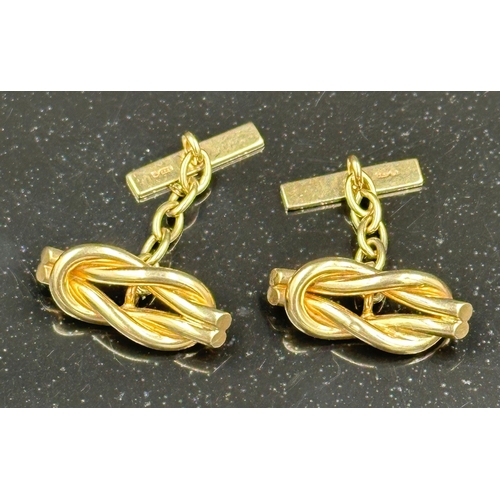 507 - A pair of 9ct gold cuff links with a knot style design, an approximate weight of 7.3g.