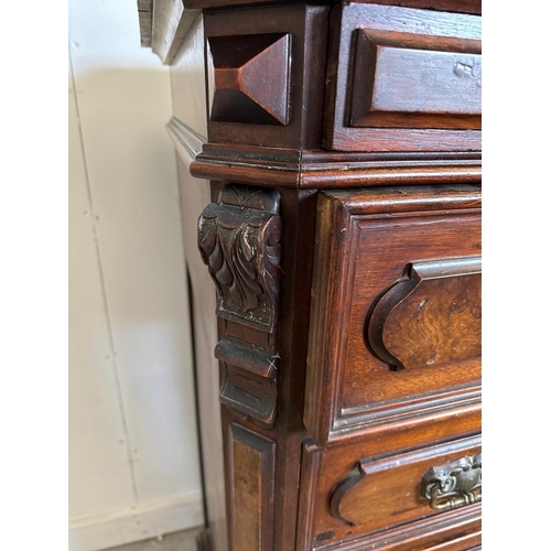 51 - An oak chest of drawers with five standard drawers, a glove drawer and ornate brass drop handles (H1... 