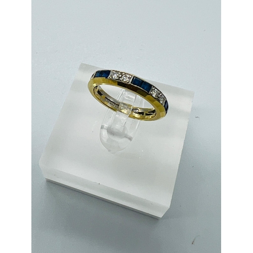 519 - A sapphire and diamond eternity style ring in 18ct gold, approximate size L