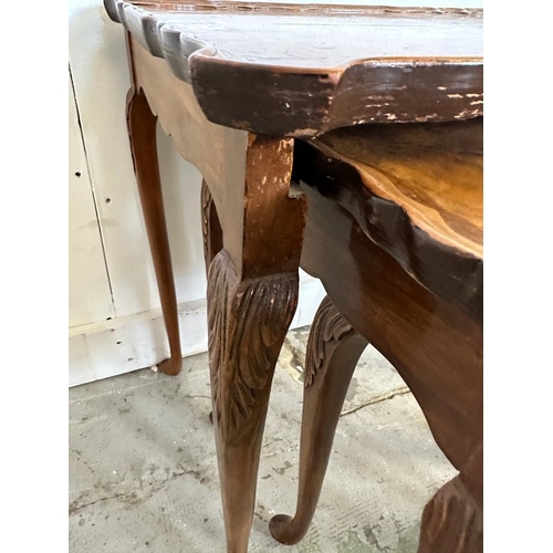 52 - A nest of four bur walnut side tables with crimped tops on splayed feet (H55cm W55cm D37cm)