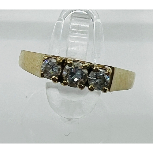 523 - A 9ct gold and three stone diamond ring, marked 375, size J 1/2