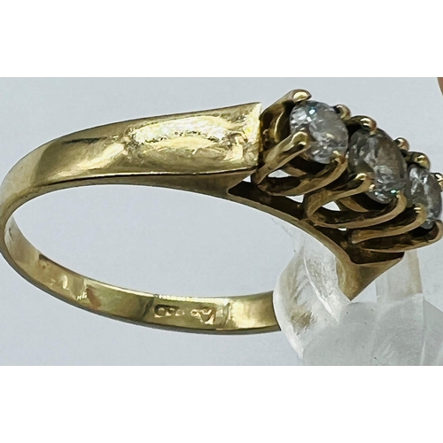 523 - A 9ct gold and three stone diamond ring, marked 375, size J 1/2