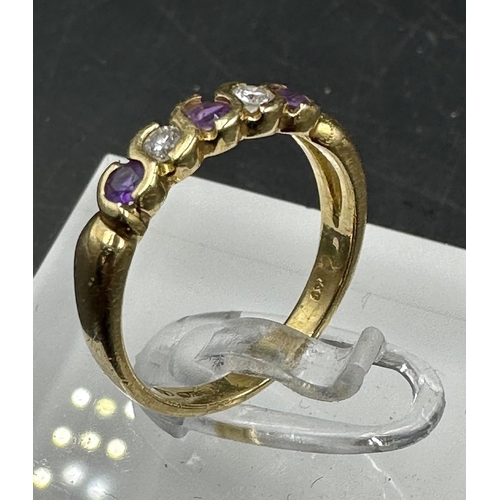 527 - An 18ct gold amethyst and cubic, zircona half hoop eternity ring Size K