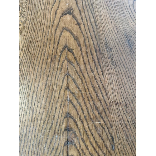 53 - An oak hall table with carved front, on turned legs and block feet (H75cm W169cm x d68cm)