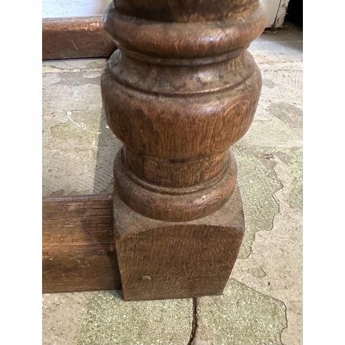 53 - An oak hall table with carved front, on turned legs and block feet (H75cm W169cm x d68cm)