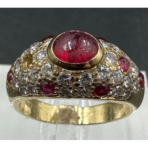 530 - An 18ct gold, marked 750, ruby and pave diamond ring, marked Cartier to the band. With a single miss... 