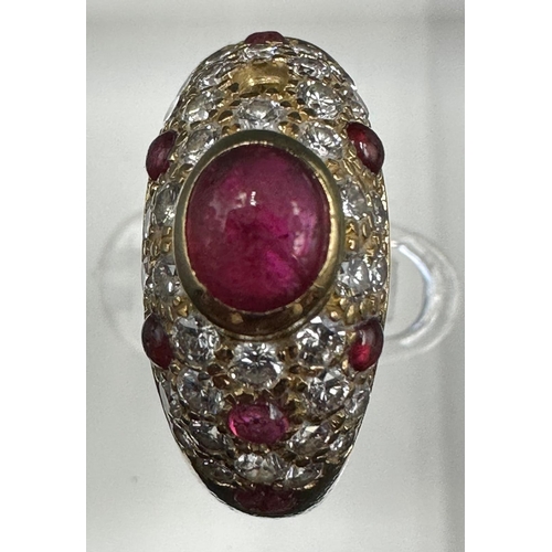 530 - An 18ct gold, marked 750, ruby and pave diamond ring, marked Cartier to the band. With a single miss... 