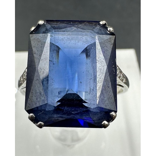 531 - A platinum and 18ct white gold sapphire ring with diamond shoulders. Approximate size M