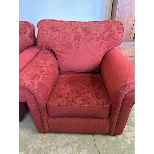 54 - A pair of red floral upholstered arm chairs