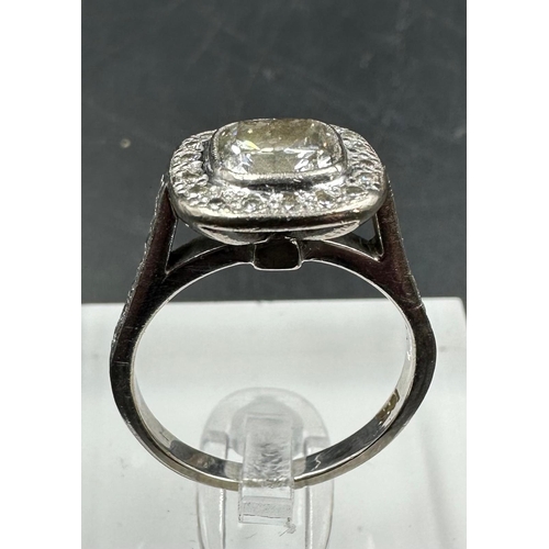 547 - An 18ct white gold diamond ring with central stone of approximately 1.2ct and approximately 0.3ct su... 