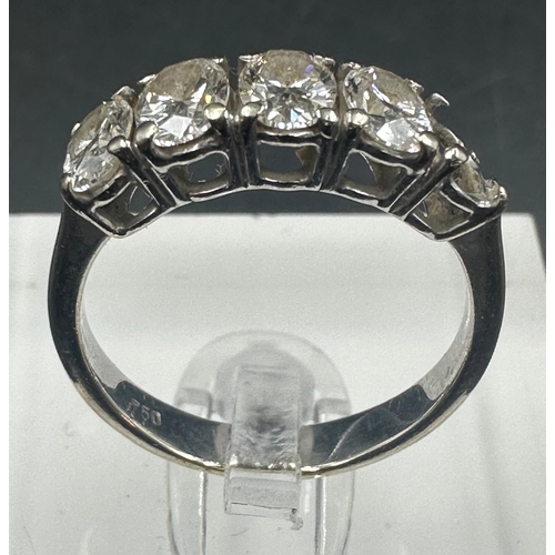 550 - An 18ct gold five stone diamond ring with an missing stone, leaving four. Approximate size M1/2