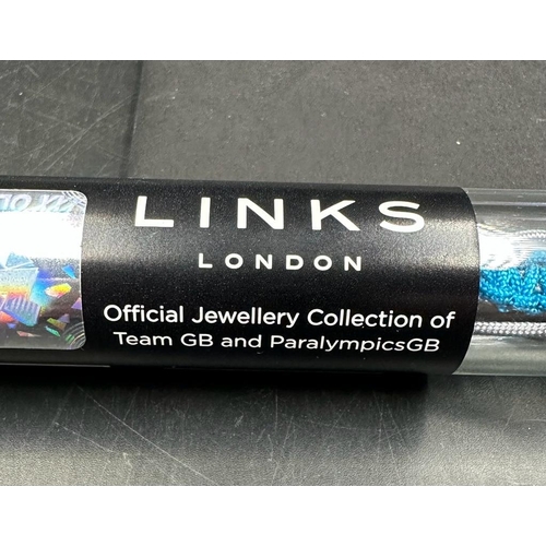 552 - A 2012 Links Of London bracelet in original tube with bag and catalogue