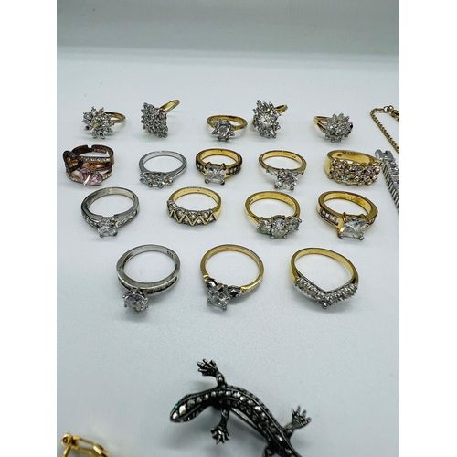 561 - A selection of costume jewellery to include a wide range of white stone fashion rings, a silver line... 