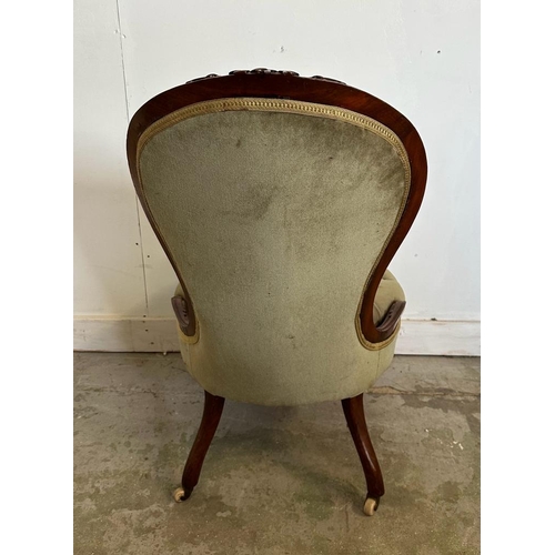 57 - A mahogany Victorian button backed nursing chair in green