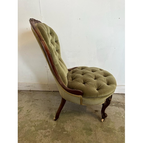 57 - A mahogany Victorian button backed nursing chair in green