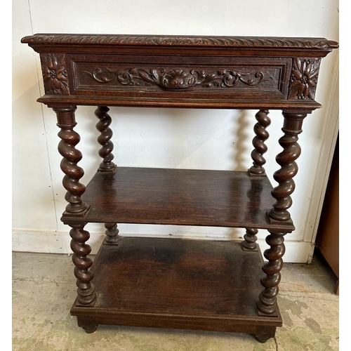 59 - An oak late Victorian buffet, two shelves on barley twist support with a single carved fronted drawe... 