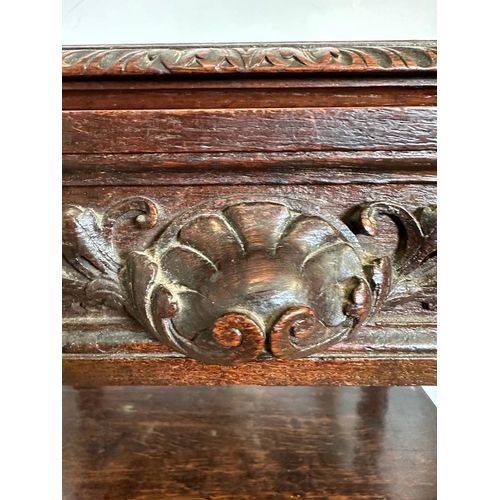 59 - An oak late Victorian buffet, two shelves on barley twist support with a single carved fronted drawe... 