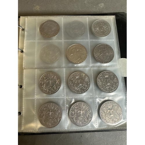 627 - An album of collectable coins, some US, some UK Crowns, five five pound coins.