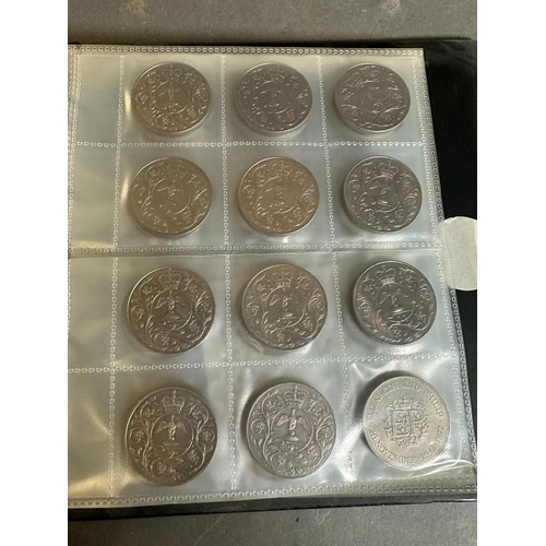 627 - An album of collectable coins, some US, some UK Crowns, five five pound coins.