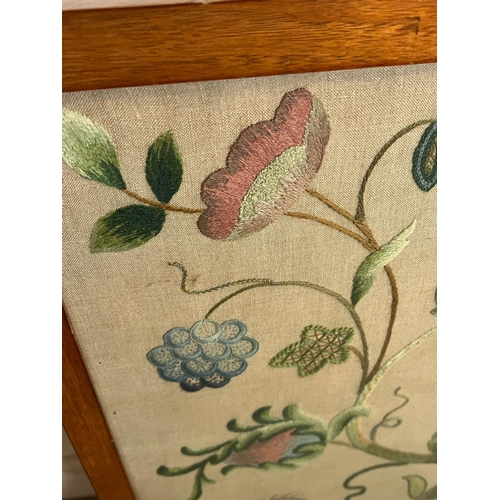 63 - A fire screen with needlework to centre (H84cm E62cm)