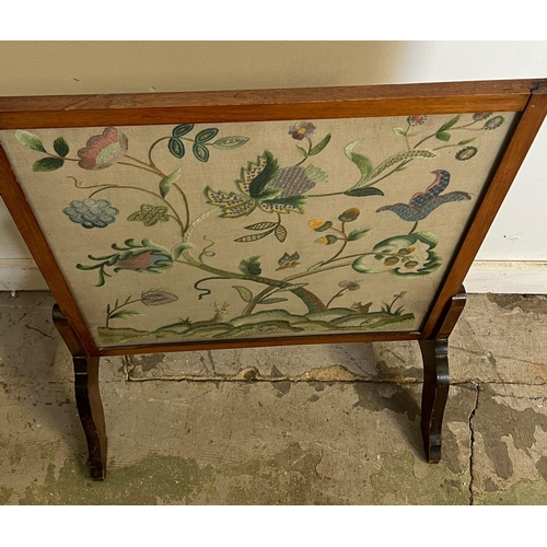 63 - A fire screen with needlework to centre (H84cm E62cm)