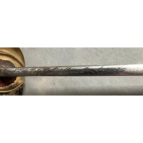 639 - A French Louis phillippe Officers infantry sword. Brass mounting, short tailed cap bordered with lau... 