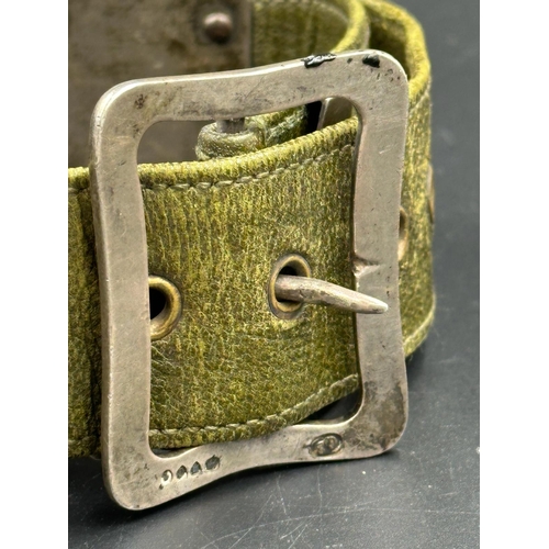 645 - A green leather belt with hallmarked silver fitments, hallmarked for London makers mark GB for possi... 