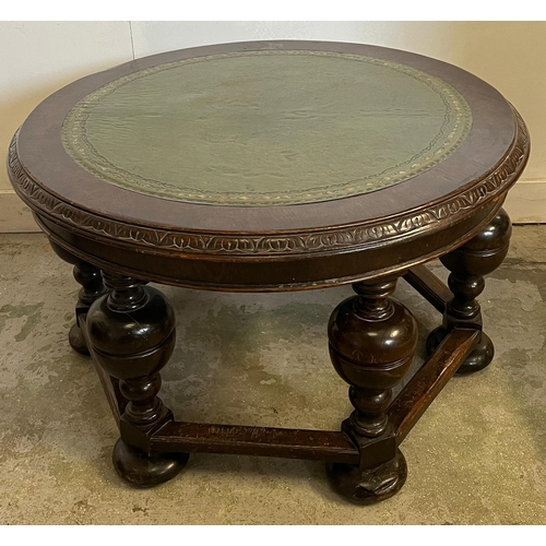 65 - A circular coffee table with a green leather top with baluster legs (H52cm Dia87cm)