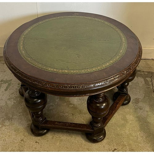 65 - A circular coffee table with a green leather top with baluster legs (H52cm Dia87cm)