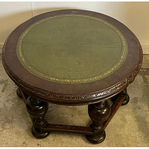 65 - A circular coffee table with a green leather top with baluster legs (H52cm Dia87cm)